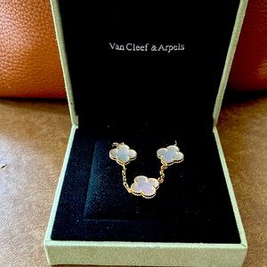 Van Cleef & Arpels Vintage Alhambra 5 motifs design on gold overlay.